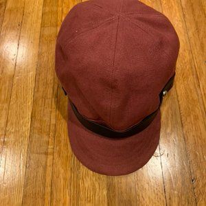 cranberry pink newsboy cap with black trim…